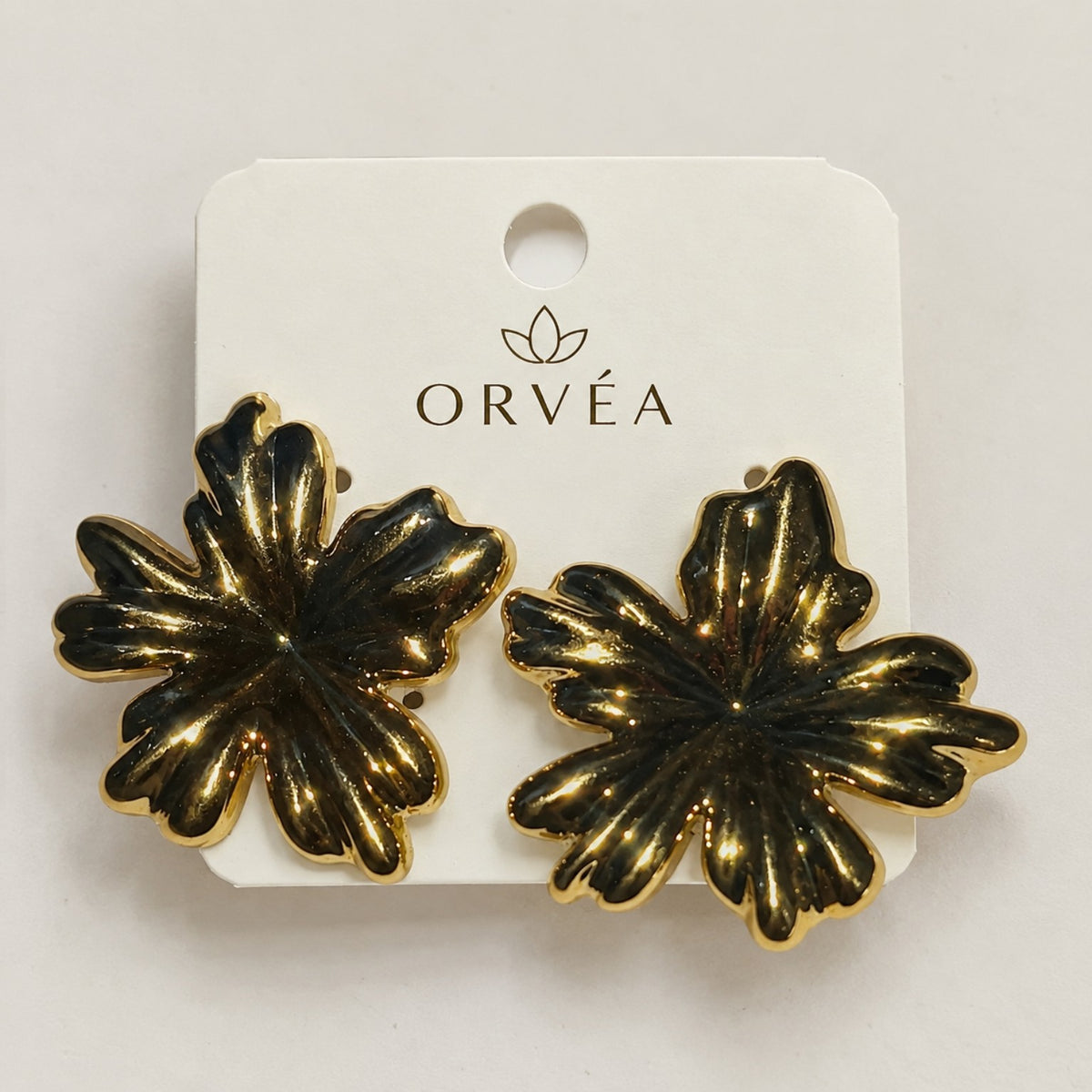 ORVÉA gold flower statement earrings