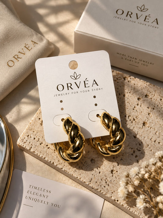 ORVÉA twisted gold hoop earrings